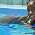 Spanish Girl Loves Dolphins in Mexico