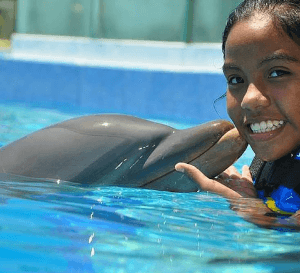 Spanish Girl Loves Dolphins in Mexico